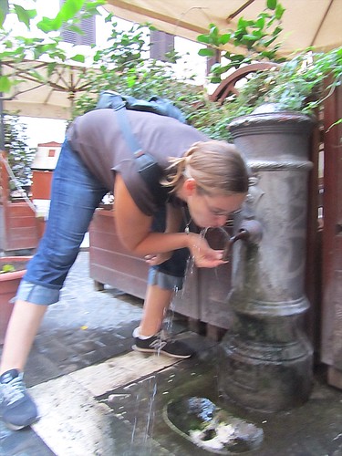 Sarah drinking from Roman fountain